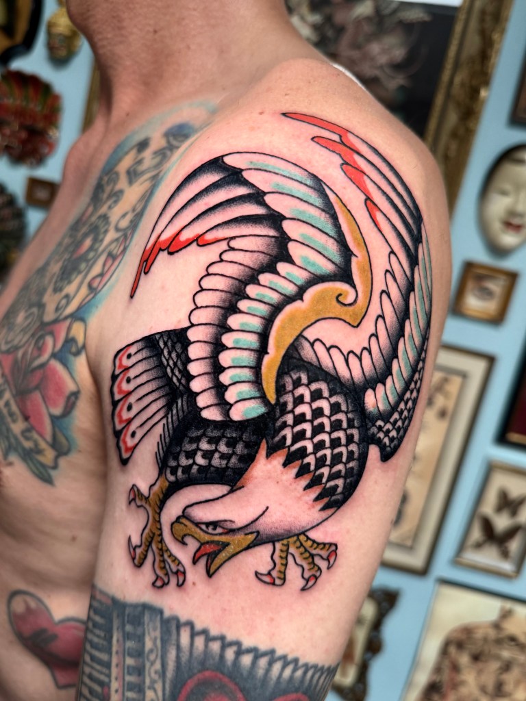 American traditional eagle tattoo covering the shoulder